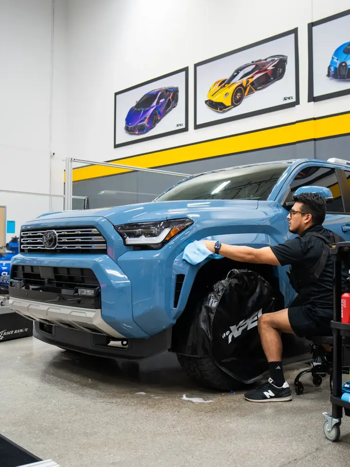 Daily-driver truck receiving paint protection film at Tier 1 Autohaus