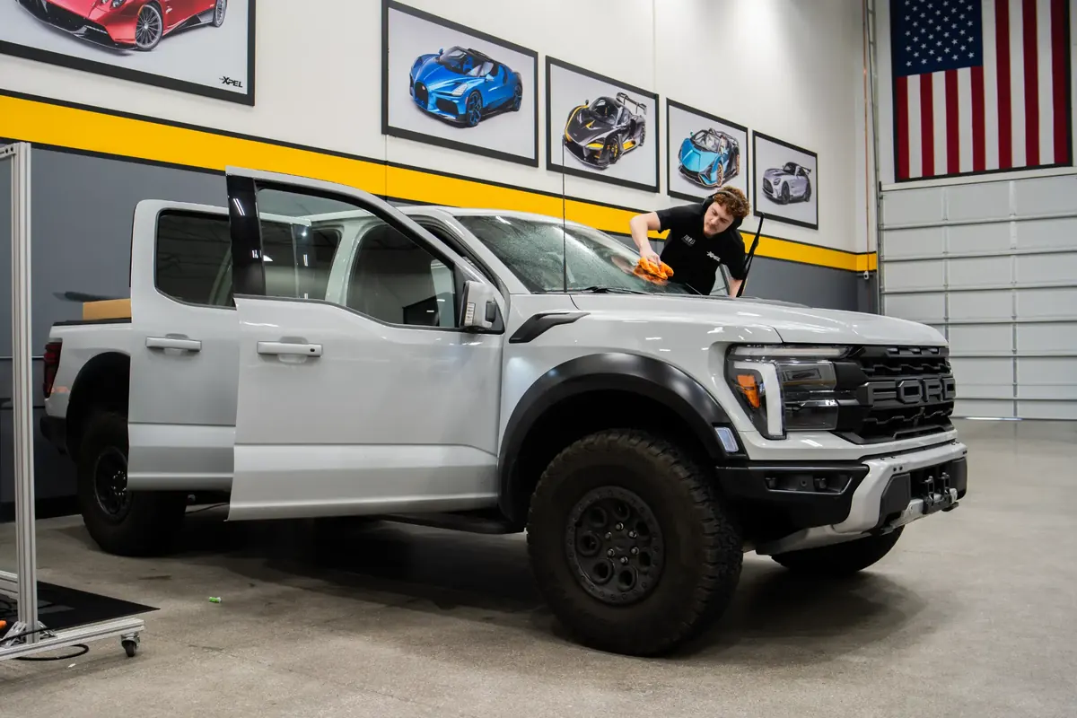 Tier 1 Autohaus precision install bay with Ford Raptor in Las Vegas